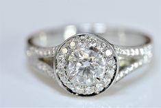 Brilliant Round Diamond Ring with Diamond Halo and a Split shank set in Platinum