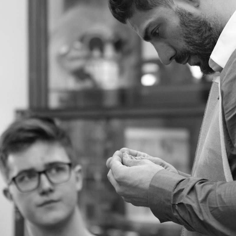 Jeweller looking at a piece of jeweller in his hands