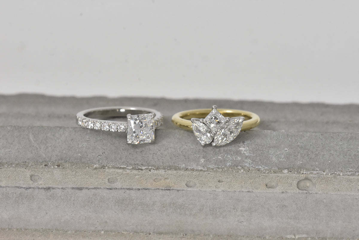 A selection of Diamond multi stone rings . 3 stone, 5 stone and 2 stone (toi et moi rings. all crafted at our London studio.